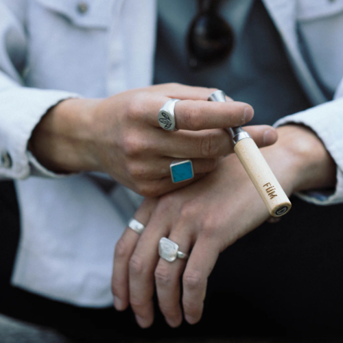 Fume Man Holding FÜM – The Natural, Nicotine-Free Alternative to Smoking and Disposable Vapes