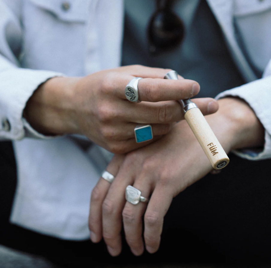 Fume Man Holding FÜM – The Natural, Nicotine-Free Alternative to Smoking and Disposable Vapes
